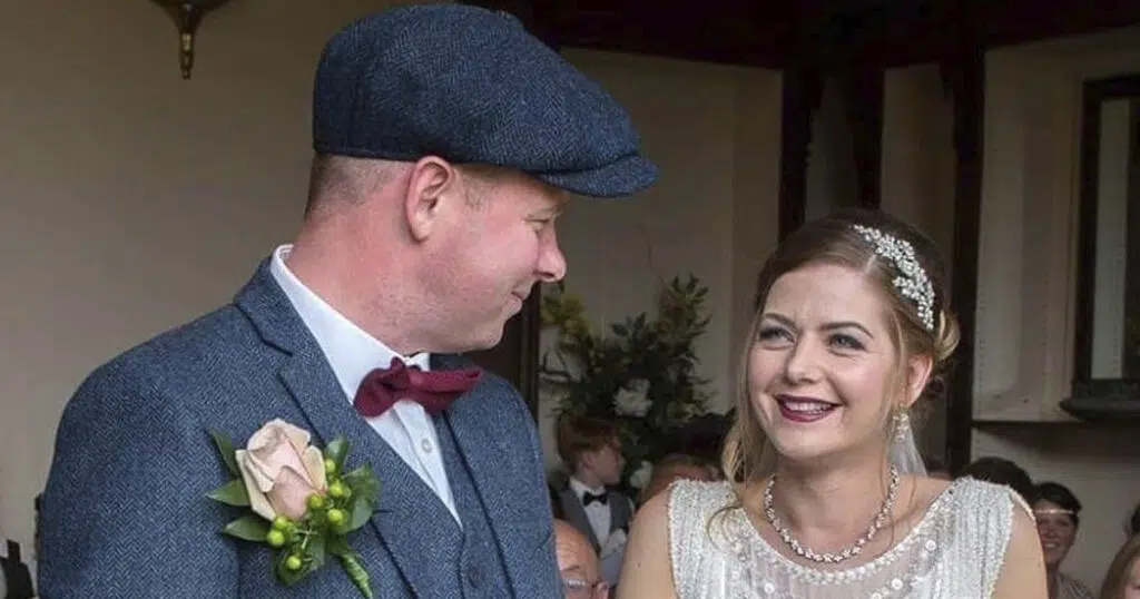 Luke Ashton and Annie Ashton on their wedding day, smiling at each other